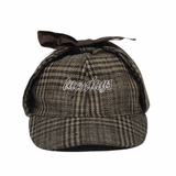 Buy Tuesdays Exploration Deer Stalker Hat Tweed. Soft 6 Panel construct, Silky Nylon lining. Approx fit 54-55 CM with slight flex. Top bow ear flap fastening. Contrast white stitch, Tuesdays Classic script embroidery. Fast Free UK and Europe Delivery/Shipping options. Buy Now pay Later with Klaran or Clearpay | Tuesdays Skate Shop | Bolton Greater Manchester United Kingdom.
